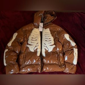 One of one brown puffer jacket